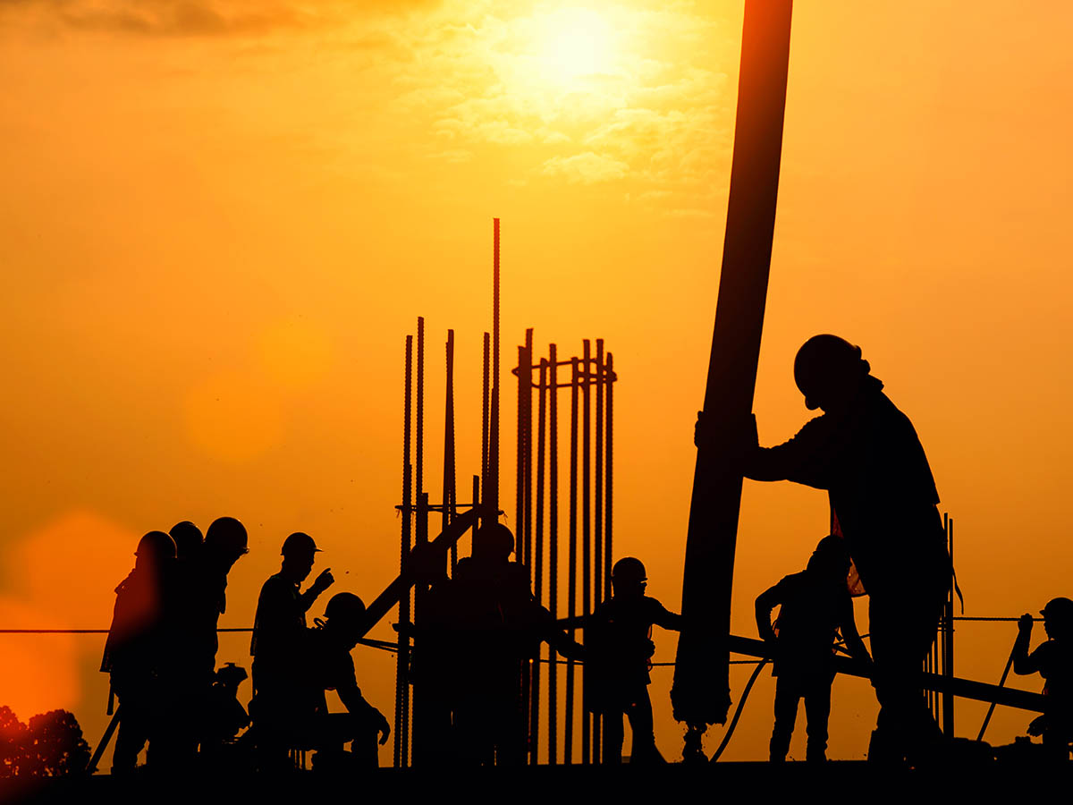 Employees working until dusk.